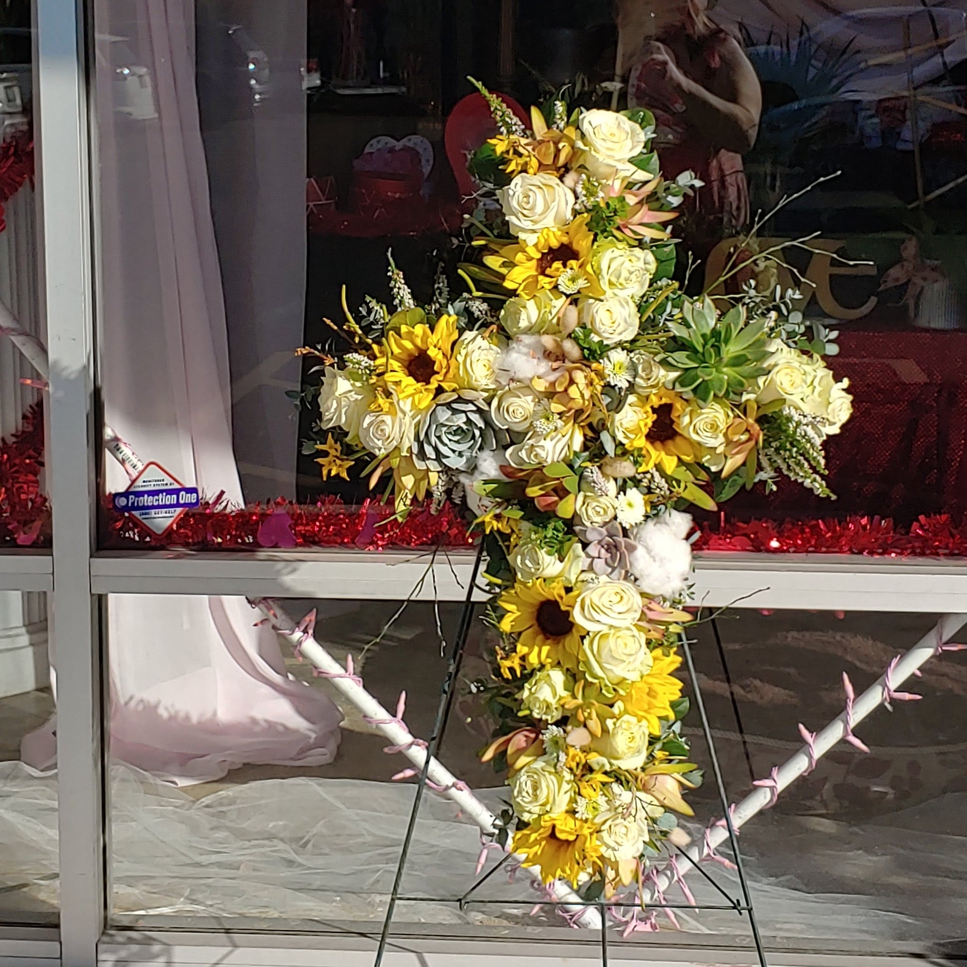 Yellow Cross Sympathy arrangement