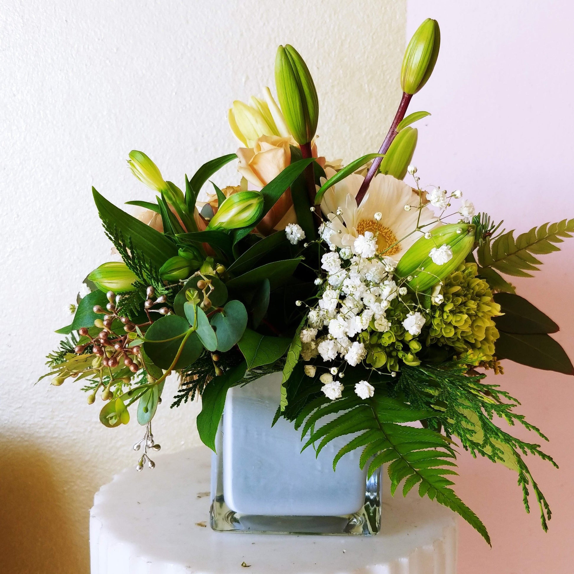 Colorful cube filled with Lillies, Gerber's and other beautiful flowers