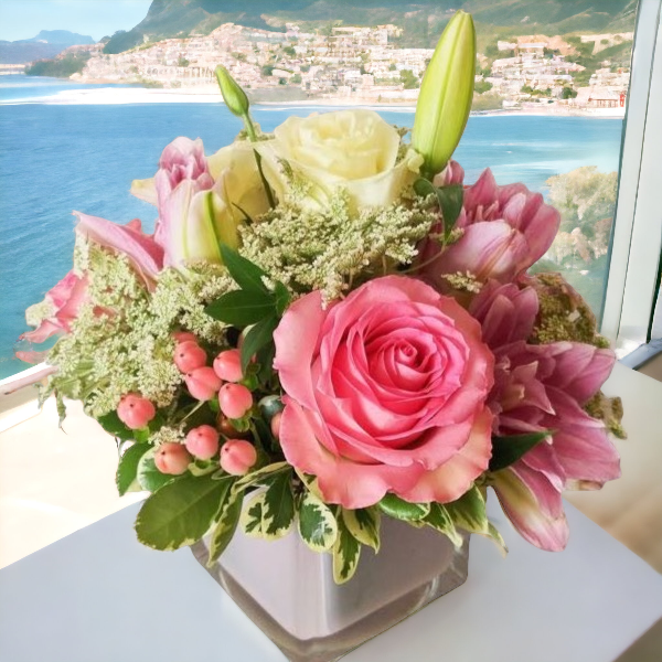 Colorful cube filled with roses hypericum, queen Annes lace & Lillies